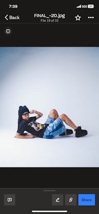 a photo of a girl laying on the ground
